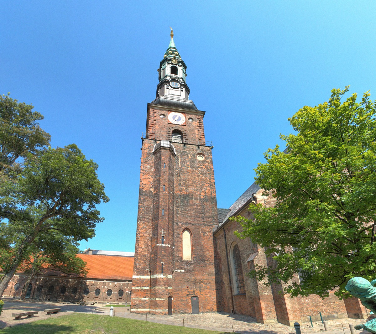 The brick tower of Sankt Petri Kirke with its green spire